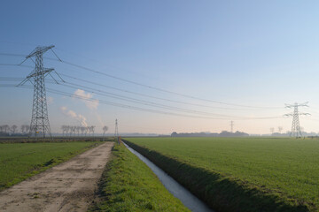 Power lines in a rural winter landscape in the Netherlands