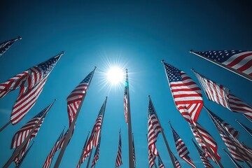 Obraz premium American Flags Waving Under Clear Blue Sky Celebrating National Holiday