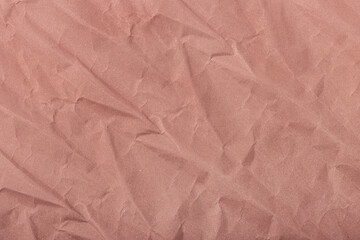 Abstract wrinkled muted mauve crumpled paper texture background