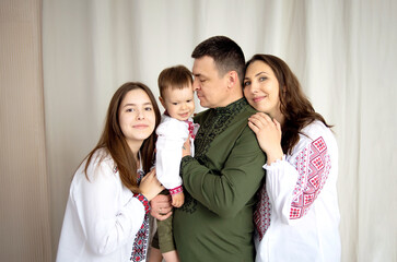 Ukrainian family in embroidered shirts. Independence Day of Ukraine.