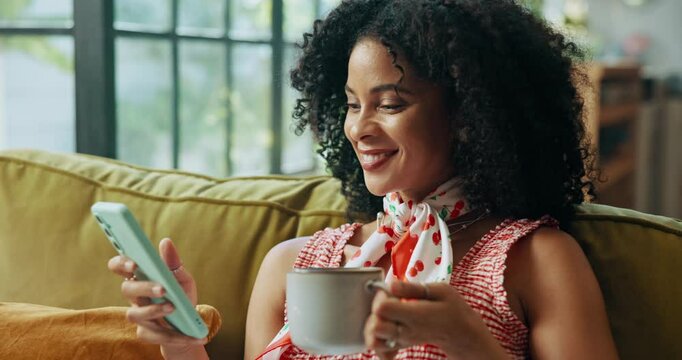 African woman, phone and coffee on sofa, texting or happy for notification, contact or online dating. Person, smartphone and smile with tea cup, chat or mobile app for social media in lounge at house