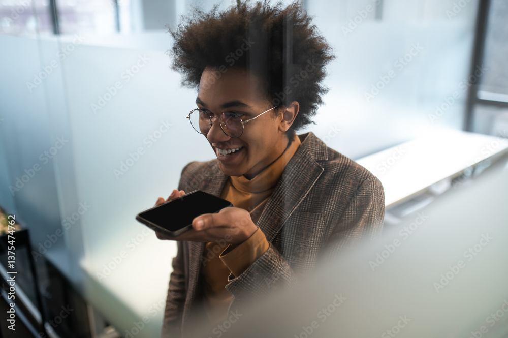 Fototapete businessman using smartphone recording voice message smiling connecting with clients in office