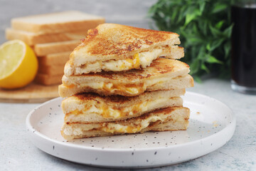Grilled cheese sandwiches served for eating