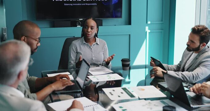 Workshop, group and business woman in discussion for financial services, banking and planning. Team, cooperation and manager speaking in office for investment meeting, profit growth and strategy idea