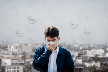 Air pollution quality of dust PM 2.5 is toxic and dangerous to health..Asian young man wearing a...