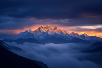 View of the Himalayas during a foggy sunset night - Mt Everest visible through the fog with dramatic and beautiful lighting