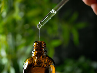 Dropper Pipette bottle for Cosmetic serum, essential oil, Herbal Aroma Theraphy oil set on dark...