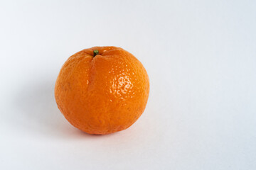 Ripe tangerine on a white background. Tangerine on a white background.