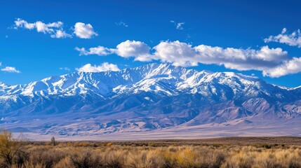 A sweeping mountain view captures nature’s grandeur, framed by open sky perfect for text or titles.