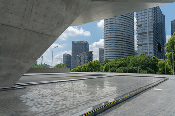 empty concrete ground in front of modern office buildings in downtown. floor for copy spac