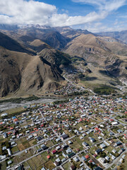 Top view of Stepantsminda, Kazbegi, Georgia. Mountain valley. Georgian mountain expanses