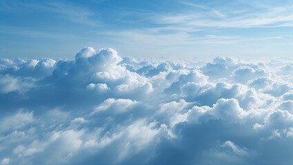 Fototapeta premium Flying above soft white clouds covering blue sky