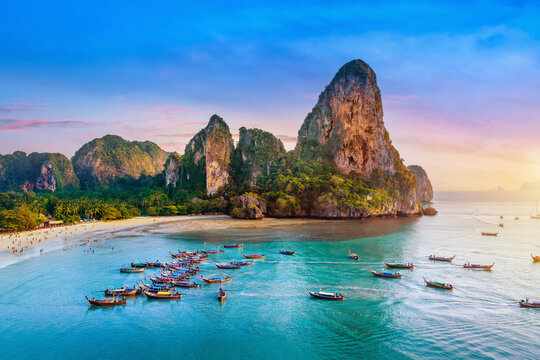 Railay beach with long tail boat in Krabi, Thailand.