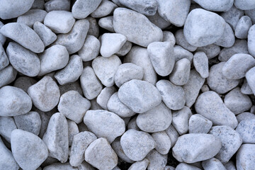 White pebbles, stone for landscape design. Texture and background, decorative stone.