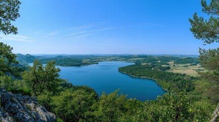 The panoramic view captures the lake&rsquo;s serene beauty, framed by vibrant nature and open space for text.

