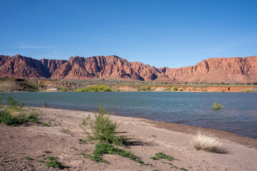 View of lake and red rocks at Fire Lake Park At Ivins Reservoir, Utah, USA.