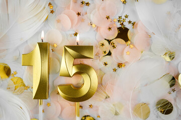 Fifteenth Birthday Celebration with Gold Candle and Confetti. Golden numeral fifteen birthday...