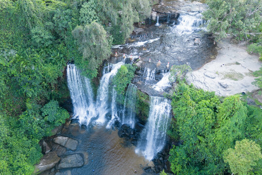 Cambodia, Phnom Kulen, beautiful waterfall is in the middle of a lush green forest