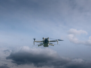 Drone is flying in the sky above a field