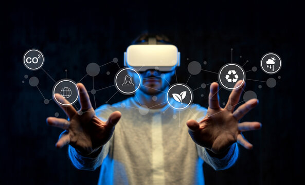 Person Using Virtual Reality Headset with Interactive Icons Representing Sustainability, Environment, Technology, and Connectivity Concepts