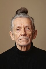 Fototapeta premium Portrait of a Senior Man with a Top Knot Hairstyle