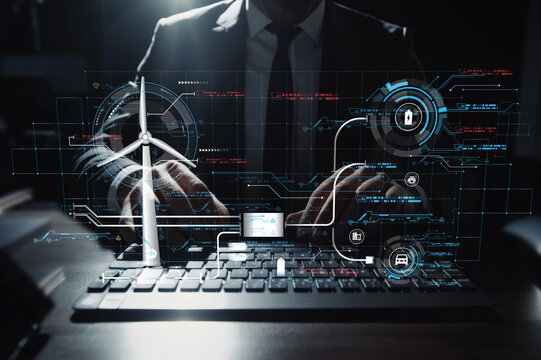 Businessman Working with Futuristic Technology Dashboard Displaying Renewable Energy Data and Security Interfaces for Modern Applications