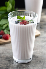 Fresh raspberry and blueberry smoothie on wooden table
