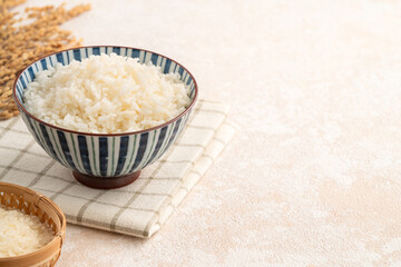 A cookd steamed white rice in a Traditional bowl.