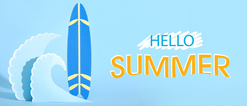 Creative composition with mini surfboard and paper waves on blue background