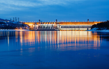 View of a hydroelectric dam on a river, long exposure photography at dusk