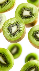 Fototapeta premium Sliced kiwi halves reveal vibrant green flesh and tiny black seeds, arranged in a striking circular pattern against a clean white background