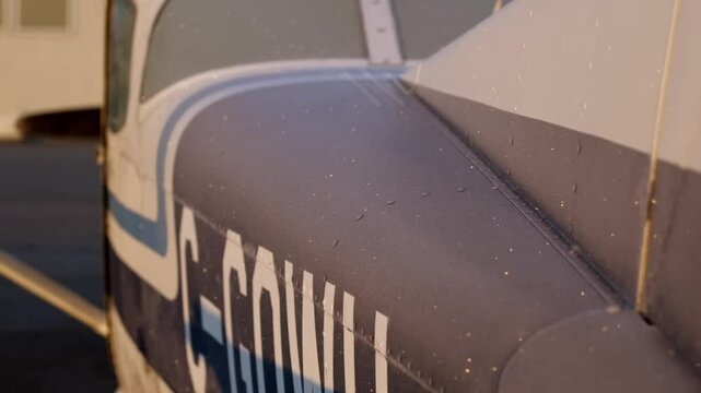 Close Up Frost on a Propeller Airplane's Fuselage in the Morning Light