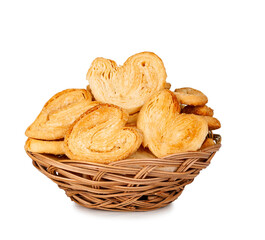 Puff pastry cookies basket isolated on a white background, contour