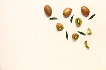 Fresh kiwi and leaves on white background