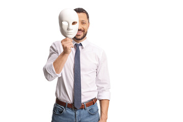 Man covering face with a white theatre mask