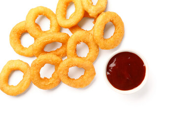 Fried breaded onion rings with ketchup on white background