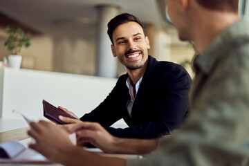 Cheerful Meeting Between Colleagues in a Bright and Modern Office Setting