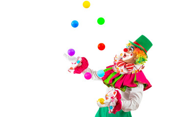 Surprised juggler clown juggling balls in the circus, man entertainer as Joker in a suit and wig,...