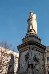 Fotobehang Oude meesters The monument to Leonardo da Vinci is a commemorative sculptural group in the Piazza della Scala, Milan, unveiled in 1872.  © Iliya Mitsk