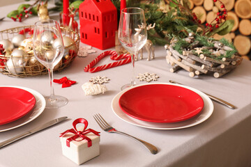 Christmas table setting with beautiful decorations, closeup