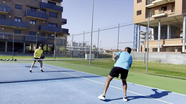 Intense pickleball rally highlighting competitive gameplay