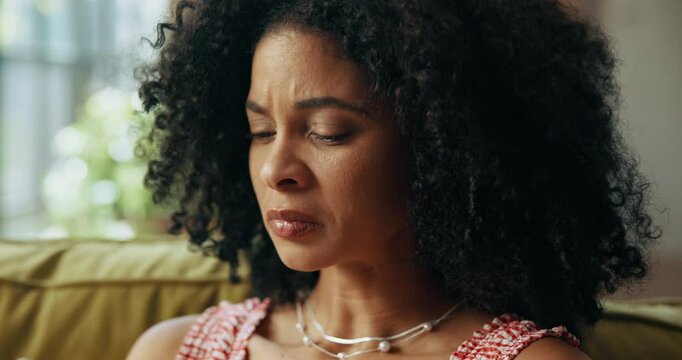 Woman, sneeze and tissue on sofa in home, sick and sinusitis with flu, allergy and rest in living room. African person, cleaning nose and nasal inflammation with cold, mucus or hygiene at apartment