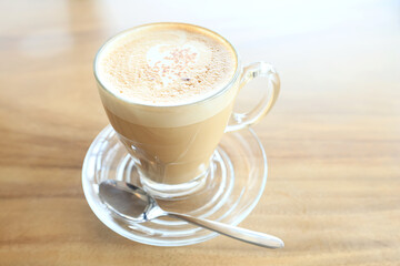 cappuccino, coffee in a clear glass cup in a cafe, soft color background food and drink, hot drink
