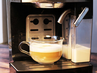 Cup of coffee and coffee machine, delicious drink