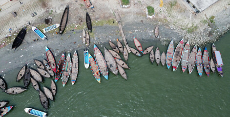 A bunch of human, transportion traditional and well decorated  fishing boat on the most highlighted and talked river Meghna. River side views  at  Chandpur ghat terminal, Bangladesh. 