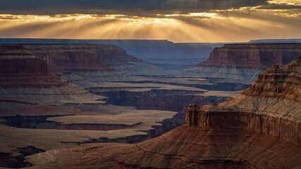 Canyon Landscape at Sunrise Sunbeams Shining Through Dramatic Clouds