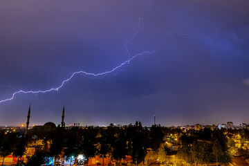 Lightning discharges in the night sky during a thunderstorm. Large thundercloud and lightning...
