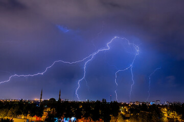 Lightning discharges in the night sky during a thunderstorm. Large thundercloud and lightning...