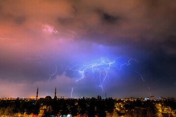 Lightning discharges in the night sky during a thunderstorm. Large thundercloud and lightning...