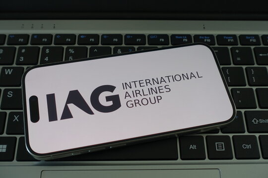 Kiel, SH, Germany, 04-01-2025 International Airlines Group logo displayed on a smartphone keyboard creates a modern representation of the aviation industry
